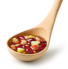 vegetable soup in wooden ladle