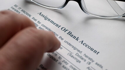 Finger tapping on assignment of bank account