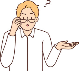 Fototapeta premium Stunned man in glasses feel confused
