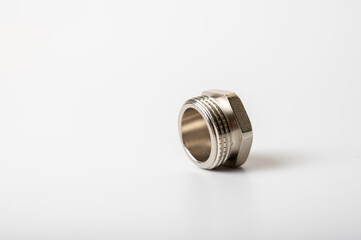 brass metal plugs, joints, adapters, hex key plugs for water isolated on light background close up plumbing connections and parts