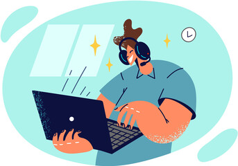 Man in headphones stands with laptop in hands and types or communicates via video call