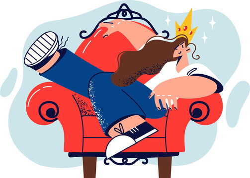 Young woman with crown on head sits in red chair with legs up and behaves selfishly because