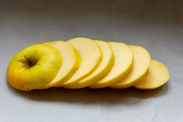 A pile of sliced apples on a table