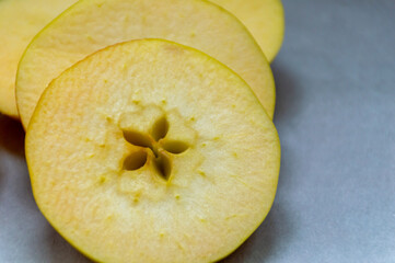 Sliced ​​yellow apple where the core is visible