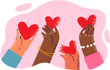 Hearts in hands of people different races symbolize kindness and charity towards ethnic minorities