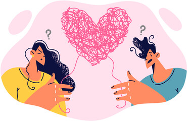 Man and woman confused in feelings and relationship are standing near clot of thread in form heart