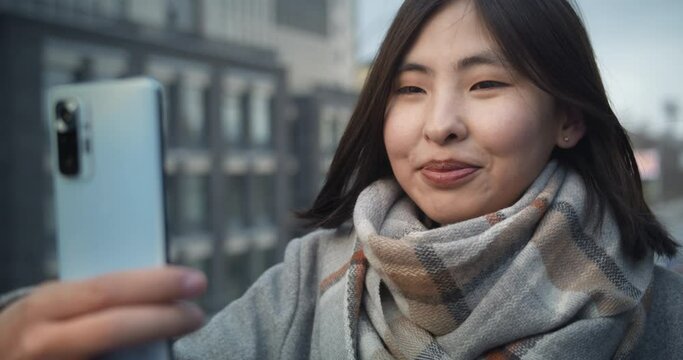 Girl tolking on video chat. Happy communication with frends. Smile. Video conference. Camera lens flare.
