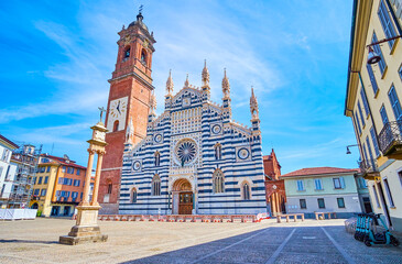 Cathedral of Monza with outstanding marble facade and high bell tower, Italy