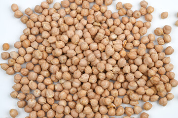 Close up of a pile of chickpeas on white background