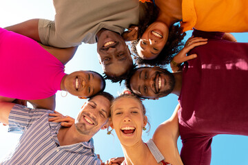 Portrait of happy diverse friends embracing and smiling at beach, with copy space - obrazy, fototapety, plakaty