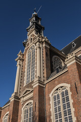 Fototapeta na wymiar Western Church (Westerkerk, 1620 - 1631) - a Dutch Protestant church in Amsterdam. It lies in the most western part of the Grachtengordel neighborhood. Amsterdam, The Netherlands.