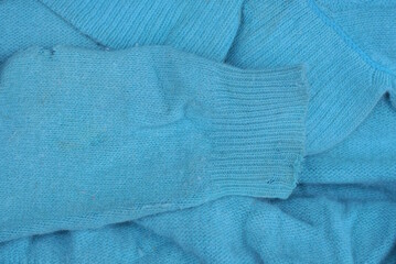 blue wool fabric texture old sweater with sleeve