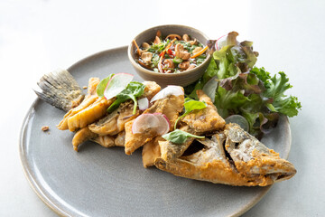 fried fish with vegetable and on table. top view shot