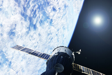 Space satellite above the Earth. Elements of this image furnishing NASA.