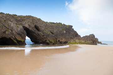 Fototapeta na wymiar Rock formation in San Antolin beach, Spain