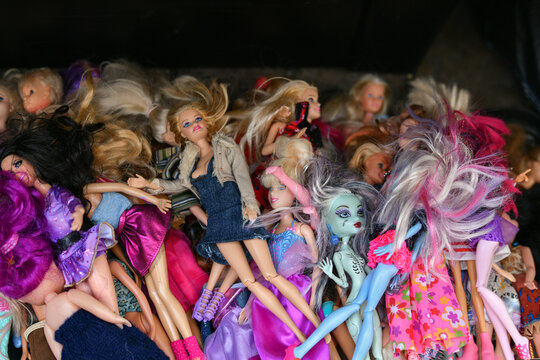 PARIS, FRANCE - NOVEMBER 19, 2022: Various of used fashion dolls Barbie, Ken, Shelly, Chelsea, Kelly, Bratz, Moxie, My Scene, Winx, Witch