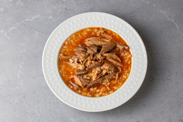 Turkish Soup Beyran with Lamb Meat, Rice, Chopped Garlic and Vinegar Sauce. Traditional Organic Food. Traditional soup of Gaziantep, Turkey. (Turkish name; Beyran corbasi)