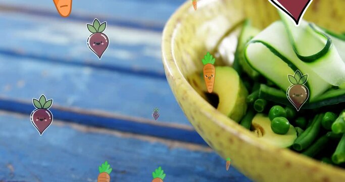 Animation of carrot and beetroot icons falling over bowl of fruit salad on blue wooden table