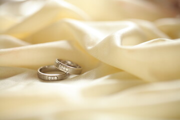 Close up of an elegant diamond rings on woman finger.love and wedding concept.soft and selective focus.