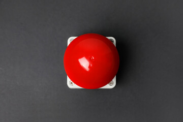 Red button of nuclear weapon on grey background, top view. War concept