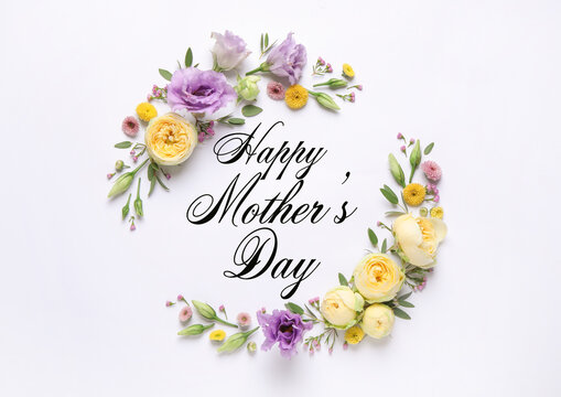 Happy Mother's Day. Greeting card with frame of beautiful flowers on white background, flat lay