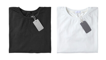 Stylish t-shirts with tags on white background, top view