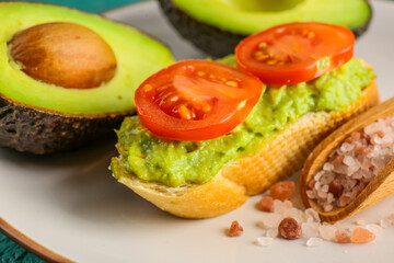 Delicious avocado toast with tomatoes on plate, closeup