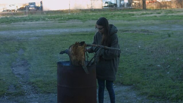 Young Woman Tends To Trashcan Fire In Rural America Countryside BMPC4K