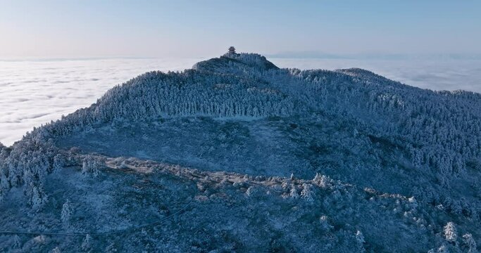 snowy mountain cliff above the clouds aerial view of Emei mountain in the winter 