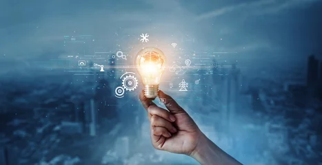 Foto op Plexiglas Creative, new ideas and innovation, Hand holding light bulb and smart brain inside and innovation icon network connection on dark blue city background, innovative technology in science and industrial. © ipopba