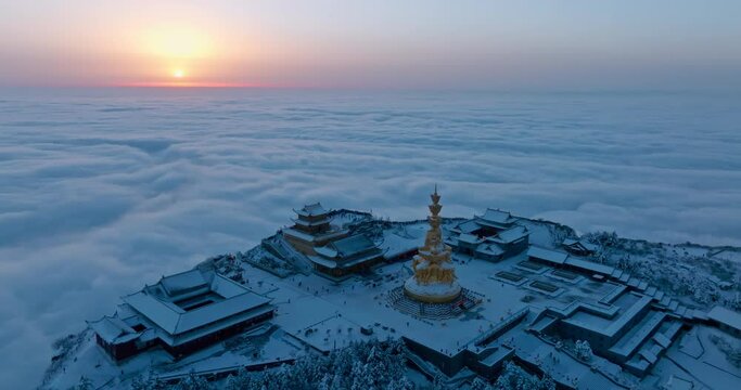 sunrise at Emei mountain summit at winter day with sea of clouds