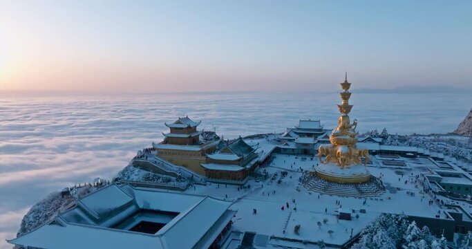 sunrise at Emei mountain summit at winter day with sea of clouds