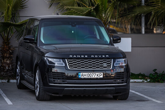 Side, Turkey – February 18 2023:    white Land Rover Range Rover  is parked  on the street on a warm day