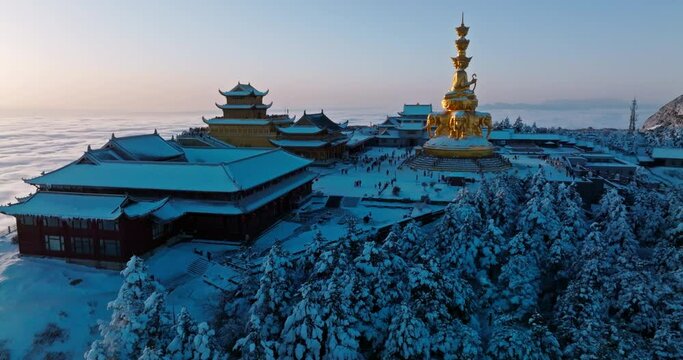 sunrise at Emei mountain summit at winter day with sea of clouds