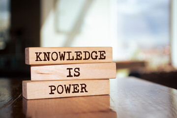Wooden blocks with words 'Knowledge is power'.