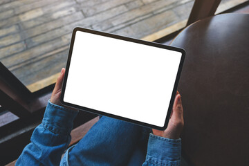 Top view mockup image of a woman holding digital tablet with blank white desktop screen