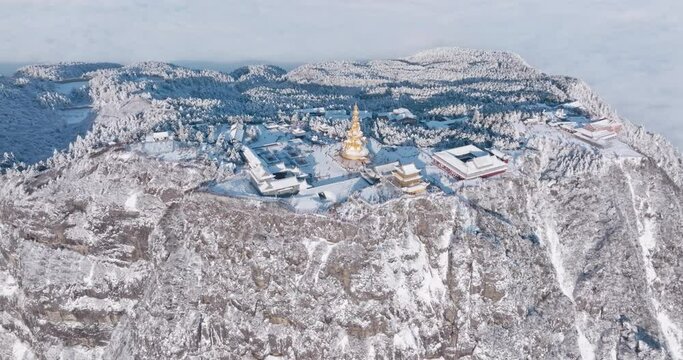 Aerial view winter landscape of emei mountain golden summit above the clouds
