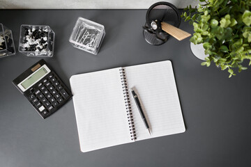 Office desk table with supplies, paper, calculator. Top view with copy space. Selective focus. Business Financing Accounting Banking Concept