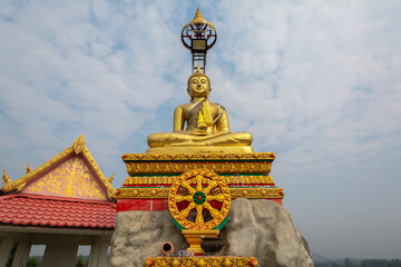 The golden Buddha statue at Tham Champathong monastery, Ratchaburi, Thailand