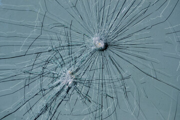 Cracks on the glass. Broken window.