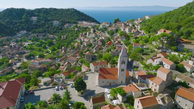 Aerial View Over Village Church Tower On Island Lastovo In Croatia - drone shot