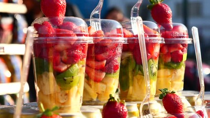 mixed fruits in a plastic jar selling at istanbul street .