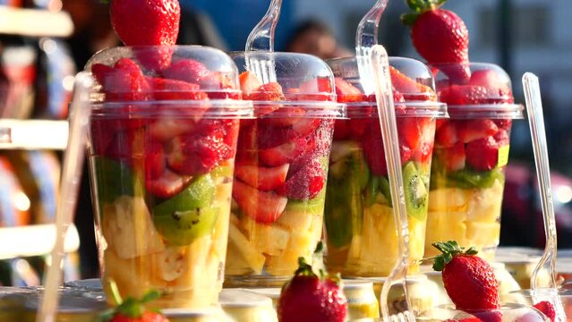 mixed fruits in a plastic jar selling at istanbul street .