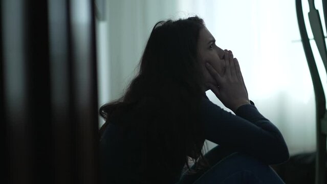 Person remembering trauma. Depressed woman suffering from mental illness sitting on floor covering face blaming herself