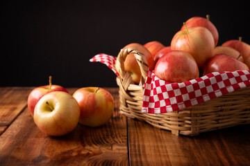 Several Royal Gala Apples (malus domestica) on wooden rustic table..Apple trees are cultivated worldwide and are the most widely used species of the genus Malus.
