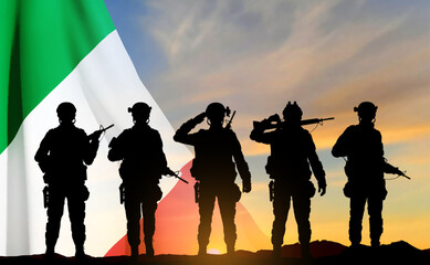 Fototapeta na wymiar Silhouettes of a soldiers with Italian flag on sunset background. Armed Forces of Italy. EPS10 vector