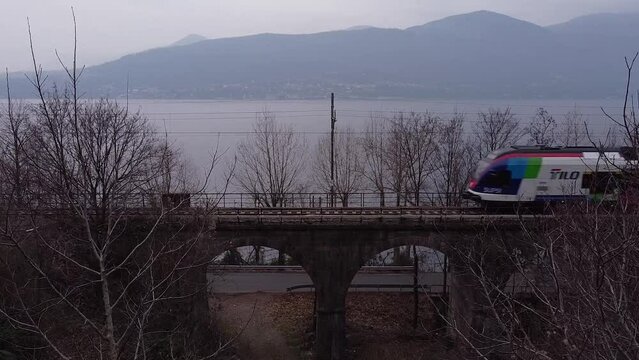 The passenger train passes on the railway near lake Maggiore (2)