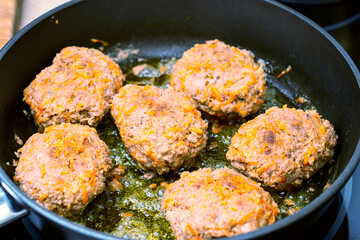 close-up, cooking meatballs in a frying pan