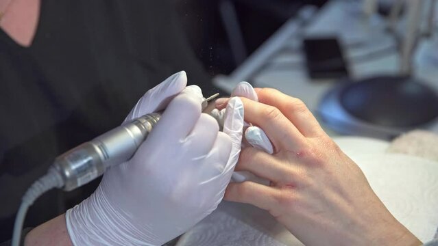 Professional cuticle removal in a beauty salon
