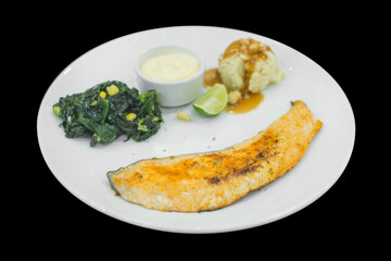 Top view of Grilled Salmon Steak with Spinach with Cream sauce, focus selective